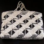 Cream and black patterned kete
